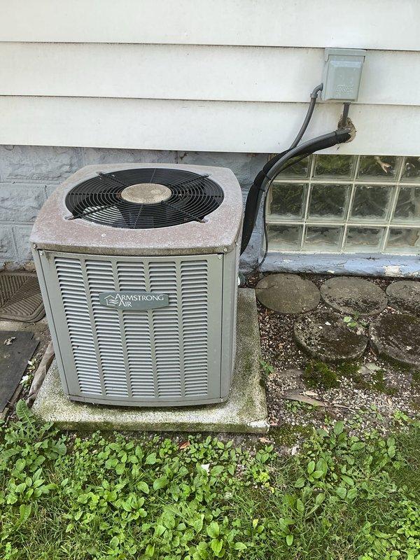 Performed seasonal maintenance on Armstrong air conditioning condenser unit. Completed comprehensive system inspection including electrical measurements with diagnostic clamp meter, verified proper amperage draw, cleaned condenser coils, and confirmed unit operational status with all components functioning within manufacturer specifications.