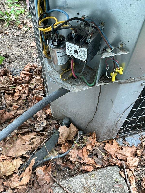 Responded to no-cooling call on 3-year-old central air conditioning system. Upon arrival, verified thermostat was calling for cooling but outdoor condensing unit failed to energize. Inspected electrical components at outdoor unit and identified failed capacitor. Tested capacitor with multimeter and confirmed complete failure with zero microfarad reading. Removed defective TITAN capacitor and installed new dual-run capacitor with proper microfarad rating for compressor and condenser fan motor. Verified all electrical connections were secure and properly terminated. Cycled system through complete cooling operation and confirmed compressor and condenser fan motor started properly. Monitored unit through full cycle to ensure proper operation. System restored to normal cooling function.