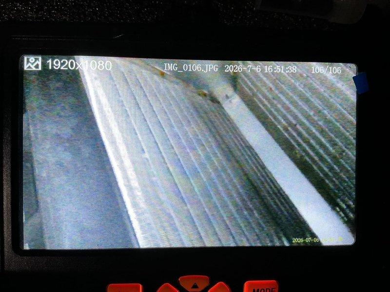 Responded to no-cooling complaint on central air conditioning system. Upon arrival, confirmed unit running continuously with airflow present but inadequate cooling performance. Customer reported filter replacement prior to service call with no improvement. Performed visual inspection of outdoor unit and refrigerant lines with no visible frost or condensation abnormalities noted.

Conducted internal system inspection using borescope camera to assess evaporator coil condition within air handler. Documentation revealed evaporator coil fins with visible contamination and restricted airflow capacity. Images captured show significant debris accumulation between aluminum fins, consistent with lack of preventative maintenance since 2018. The reduced heat transfer efficiency from dirty coil explains continuous runtime without achieving temperature setpoint.

Recommended thorough evaporator coil cleaning and complete system maintenance to restore proper cooling capacity and efficiency.