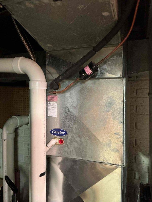 Completed scheduled heating and cooling system tune-up on Carrier HVAC unit. Performed comprehensive combustion analysis using Testo 310 II flue gas analyzer, confirming optimal system performance with stack temperature at 102.6°F, oxygen level at 10.1%, carbon monoxide at 9 ppm (17 ppm air-free), efficiency at 93.1%, and carbon dioxide at 6.11%. All readings within manufacturer specifications and safety parameters. Inspected furnace components, refrigerant lines, condensate drainage system, and electrical connections with no issues found.