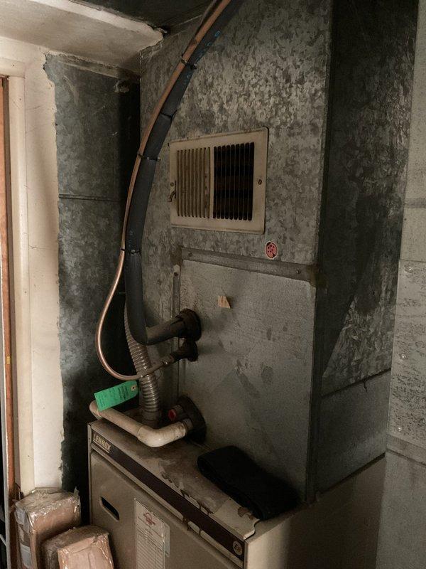 Completed comprehensive HVAC system replacement estimate for residential property to match competitor pricing from A1. Evaluated existing outdoor condensing unit with cylindrical cage housing and indoor furnace system located in basement utility area. Both units showed significant age and wear, with basement mechanical room displaying moisture concerns on surrounding concrete surfaces. Documented current equipment configuration including electrical disconnects, meter placement, conduit routing, and existing concrete pad condition for outdoor unit. Assessed ductwork connections and copper refrigerant line routing for replacement planning. Provided detailed photographic documentation of existing equipment placement, electrical service components, and installation conditions to prepare accurate material and labor specifications for complete system changeout.