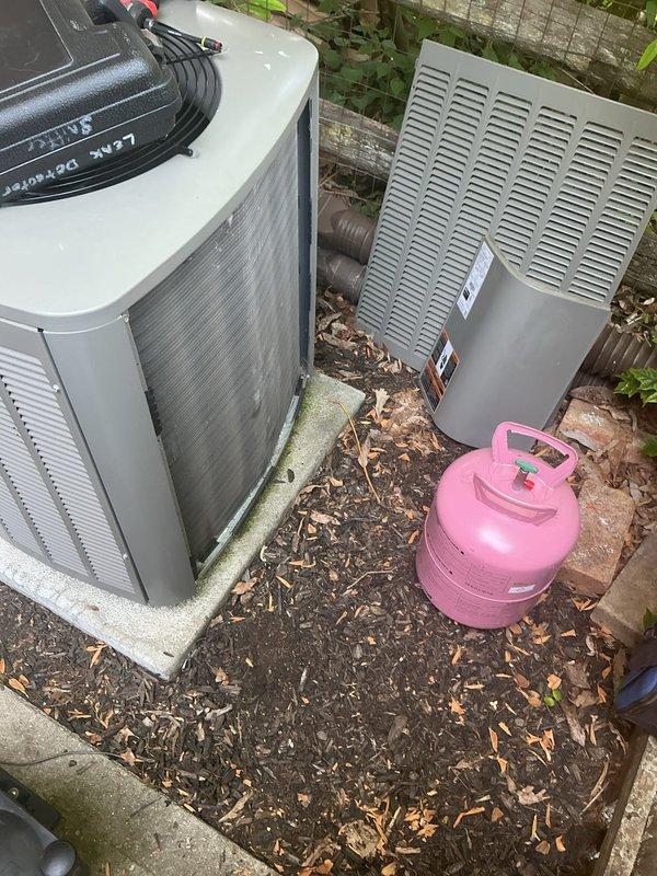 Responded to no cooling complaint on 2-year-old system. Unit was running but not producing cool air. Upon arrival, performed diagnostic evaluation of outdoor condensing unit. Found system low on refrigerant charge. Connected recovery equipment and gauges to assess refrigerant levels and system pressures. Identified refrigerant loss requiring recovery and recharge. Recovered remaining refrigerant using recovery tank, inspected refrigerant lines and connections for potential leak points. System required proper refrigerant charge restoration to resume normal cooling operation.