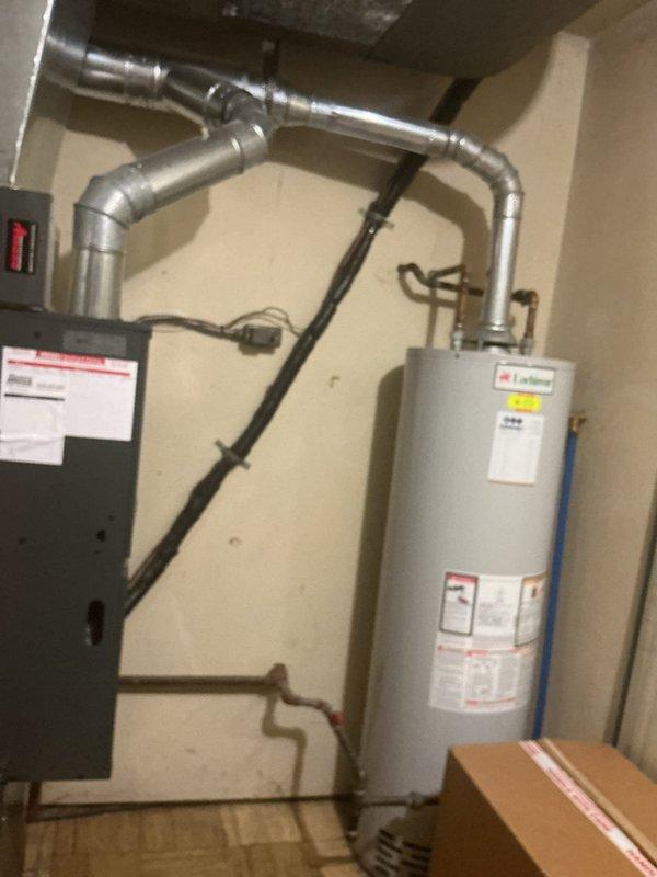 # HVAC Service Report - No Cooling Issue

Responded to a no cooling complaint on a 14-year-old residential air conditioning system. Upon arrival, performed diagnostic assessment of the HVAC unit located in the basement mechanical room. Conducted refrigerant pressure checks and identified low refrigerant charge as the primary cause of insufficient cooling performance.

Added refrigerant to manufacturer specifications to restore proper system operation. Verified proper system pressures on both high and low sides of the refrigeration circuit. Tested unit operation through complete cooling cycle to confirm adequate cooling output and proper compressor function.

Inspected associated ductwork connections and air handler components for any secondary issues. All electrical connections, condensate drainage, and safety controls verified to be functioning within normal parameters. System restored to full operational capacity with proper cooling performance confirmed before departure.