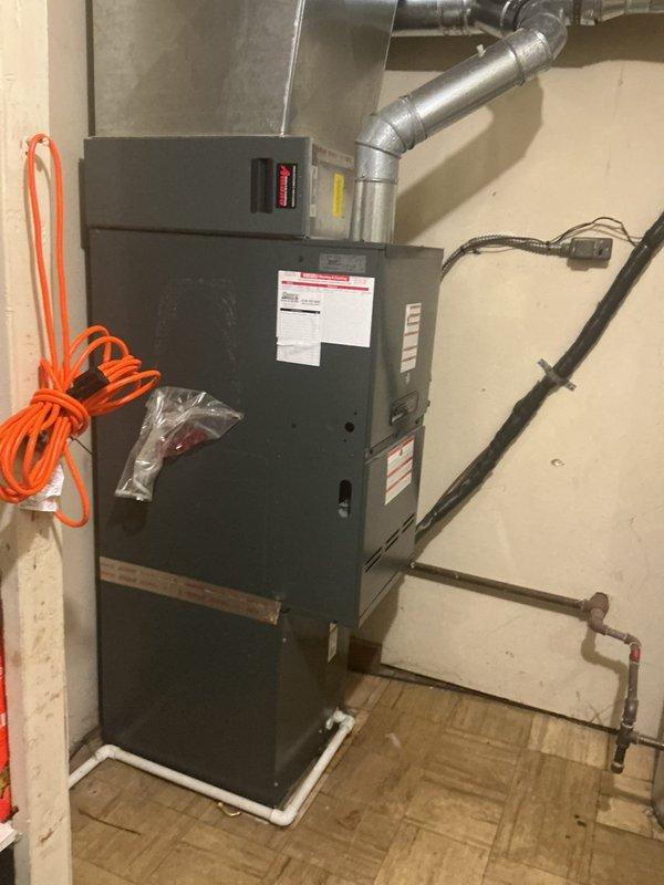# HVAC Service Report - No Cooling Issue

Responded to a no cooling complaint on a 14-year-old residential air conditioning system. Upon arrival, performed diagnostic assessment of the HVAC unit located in the basement mechanical room. Conducted refrigerant pressure checks and identified low refrigerant charge as the primary cause of insufficient cooling performance.

Added refrigerant to manufacturer specifications to restore proper system operation. Verified proper system pressures on both high and low sides of the refrigeration circuit. Tested unit operation through complete cooling cycle to confirm adequate cooling output and proper compressor function.

Inspected associated ductwork connections and air handler components for any secondary issues. All electrical connections, condensate drainage, and safety controls verified to be functioning within normal parameters. System restored to full operational capacity with proper cooling performance confirmed before departure.
