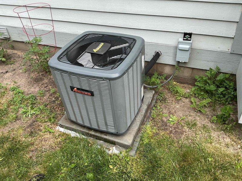 Completed comprehensive tune-up on 7-year-old Amana air conditioning system. Performed standard maintenance protocol including inspection of outdoor condenser unit, verified proper operation of all components, checked refrigerant levels, cleaned condenser coils, and tested electrical connections at disconnect box. Unit operating within normal parameters with no issues identified.