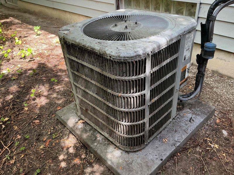 Responded to no cooling call on 5-year-old residential air conditioning system. Upon arrival, performed visual inspection of outdoor condenser unit and indoor air handler. Condenser showed significant dirt accumulation and weathering on exterior surfaces, though unit appeared structurally sound. Verified refrigerant line connections and electrical conduit at outdoor unit were intact. Inspected indoor air handler cabinet and associated copper refrigerant piping with brass service valves. System required diagnostic evaluation to determine cause of cooling failure.