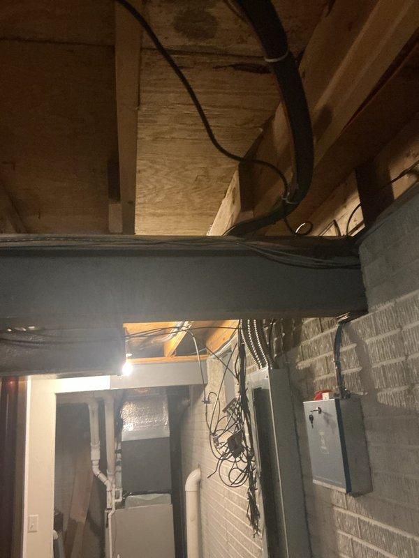 Responded to service call back for AC unit not cooling after previous freeze-up repair. Upon arrival, confirmed outdoor condensing unit operational but system still failing to produce cold air despite recent filter replacement. Conducted comprehensive diagnostic inspection of both outdoor unit and indoor air handler components in basement mechanical space. Identified underlying refrigerant system issue causing continued performance problems beyond initial frozen coil condition. Performed necessary repairs to restore proper cooling operation and verified system functionality before departure.