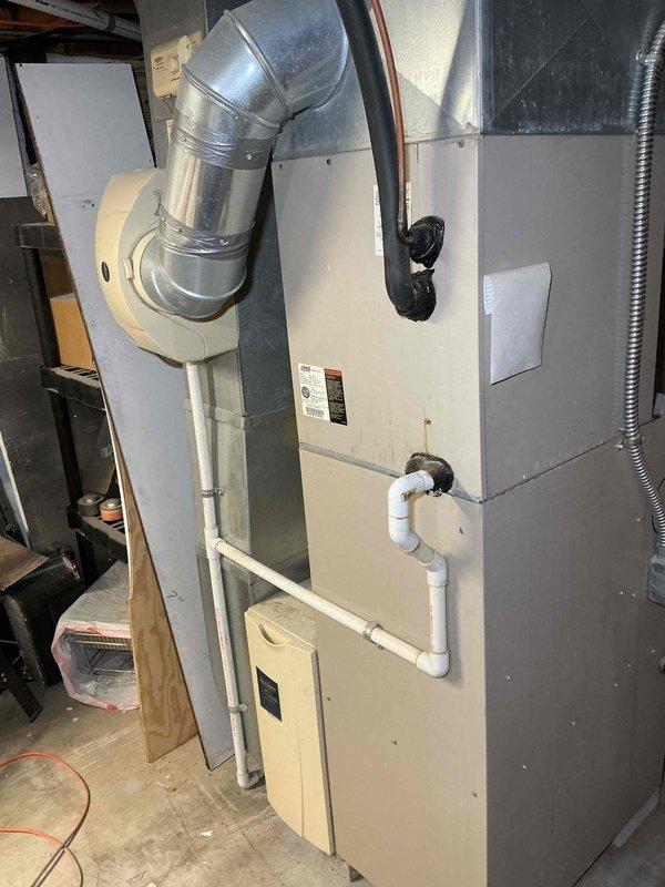 Responded to service call for air conditioning system not adequately cooling residence. Upon inspection, found 12+ year old HVAC system consisting of indoor furnace unit with air handler in basement and outdoor condenser unit. Performed diagnostic evaluation of both indoor and outdoor components, checking refrigerant levels, airflow, and overall system performance. Discussed system age and efficiency concerns with homeowner, as well as preventative maintenance membership options to extend equipment lifespan and improve reliability.