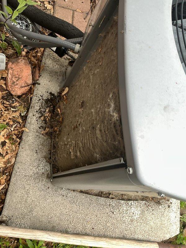 Responded to service call for air conditioning unit running continuously and unable to shut off. Upon inspection, found outdoor condenser unit heavily soiled with significant dirt, dust, and debris accumulation on exterior panels and internal components. Diagnosed thermostat control issue preventing proper cycle termination. Cleaned condenser coils and exterior surfaces, removed accumulated organic debris from unit base and surrounding area. Verified proper fan motor operation and electrical connections. System restored to normal operating cycle with proper on/off functionality.