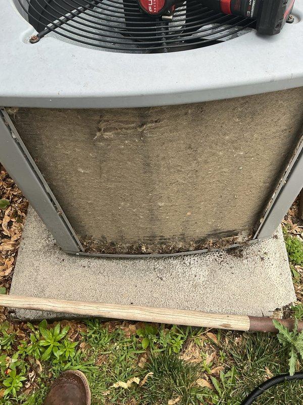 Responded to service call for air conditioning unit running continuously and unable to shut off. Upon inspection, found outdoor condenser unit heavily soiled with significant dirt, dust, and debris accumulation on exterior panels and internal components. Diagnosed thermostat control issue preventing proper cycle termination. Cleaned condenser coils and exterior surfaces, removed accumulated organic debris from unit base and surrounding area. Verified proper fan motor operation and electrical connections. System restored to normal operating cycle with proper on/off functionality.