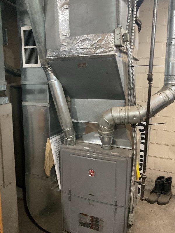 Conducted comprehensive rooftop AC unit assessment requiring ladder access. Documented existing HVAC system configuration including furnace installation, ductwork connections, air handler placement, and associated mechanical components. Provided replacement estimate based on current equipment condition and system requirements.