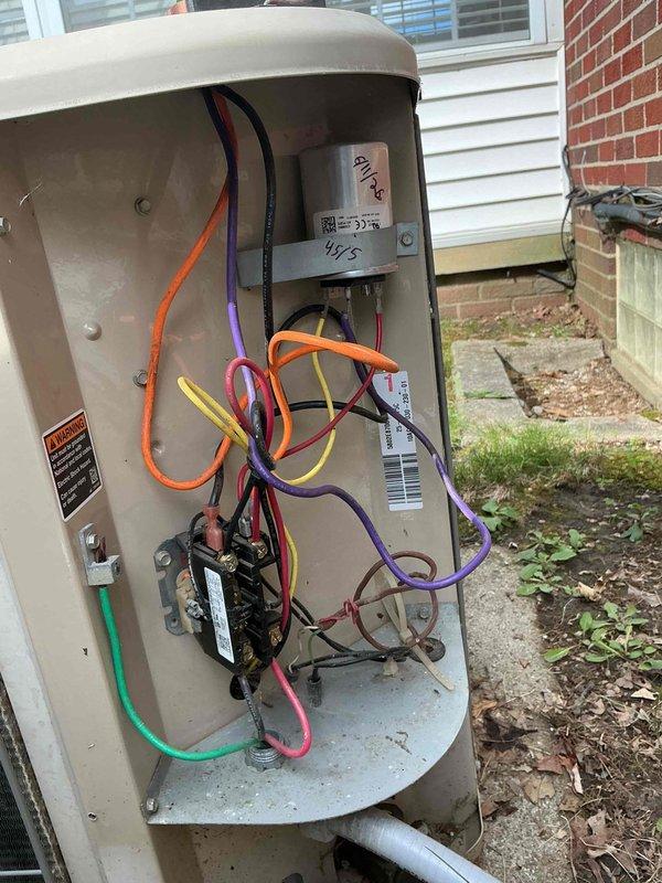 # HVAC Service Report - No Cool Call

Responded to no cooling complaint on 20+ year old residential air conditioning system. Upon arrival, performed diagnostic inspection of outdoor condensing unit. Identified failed dual-run capacitor as primary cause of system failure. Capacitor showed visible signs of weathering, surface corrosion, and electrical degradation typical of age-related component failure. Removed defective capacitor from unit and installed new replacement capacitor with proper microfarad ratings for both compressor and condenser fan motor circuits. Verified all electrical connections at contactor and terminal block were secure and properly torqued. Tested system operation and confirmed compressor and outdoor fan motor both started properly and ran within normal amperage parameters. System restored to full cooling operation.
