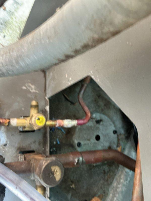 Replaced failed service valves and filter drier on HVAC system to restore proper refrigerant management and system protection. Evacuated system, installed new components with brass fittings, recharged unit to manufacturer specifications, and verified proper operating pressures at 55 PSI using calibrated digital gauges. System tested and confirmed operational with all connections leak-free and equipment cycling normally.
