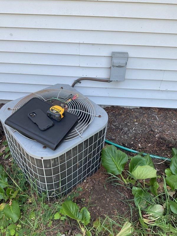 Completed comprehensive estimate for full HVAC system replacement at residential property. Assessed existing Concord furnace unit located in interior utility closet with flexible metallic ductwork and outdoor cylindrical air conditioning condenser unit positioned against exterior wall. Documented current equipment configuration including gas connections, water heater proximity, ductwork transitions, and condenser placement on grade with nearby landscaping. Provided detailed replacement specifications and equipment recommendations for complete heating and cooling system upgrade.
