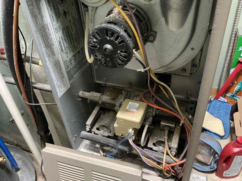 Responded to service call for thermostat installation and mechanical noise investigation on 20+ year old system. Accessed HVAC unit and inspected blower motor assembly, electrical connections, and internal components. Utilized inspection camera to examine ductwork and internal spaces for source of reported belt or mechanical noise. Verified blower wheel operation, checked motor mounting and belt tension, and assessed overall system condition.