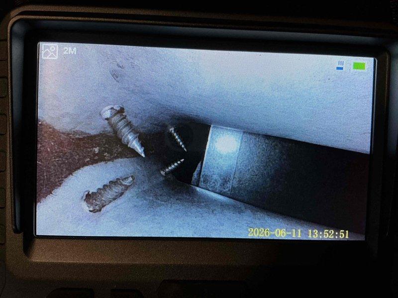 Responded to service call for thermostat installation and mechanical noise investigation on 20+ year old system. Accessed HVAC unit and inspected blower motor assembly, electrical connections, and internal components. Utilized inspection camera to examine ductwork and internal spaces for source of reported belt or mechanical noise. Verified blower wheel operation, checked motor mounting and belt tension, and assessed overall system condition.