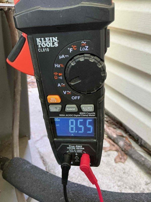 Responded to no cooling call on 15-year-old residential HVAC unit. Upon inspection, found failed dual run capacitor preventing compressor and condenser fan motor operation. Verified electrical connections and tested amperage draw, which measured 8.55 amps on compressor circuit. Replaced defective TITAN HD capacitor with proper microfarad-rated replacement, restored all wire connections, and confirmed system returned to normal cooling operation with proper amp draw.