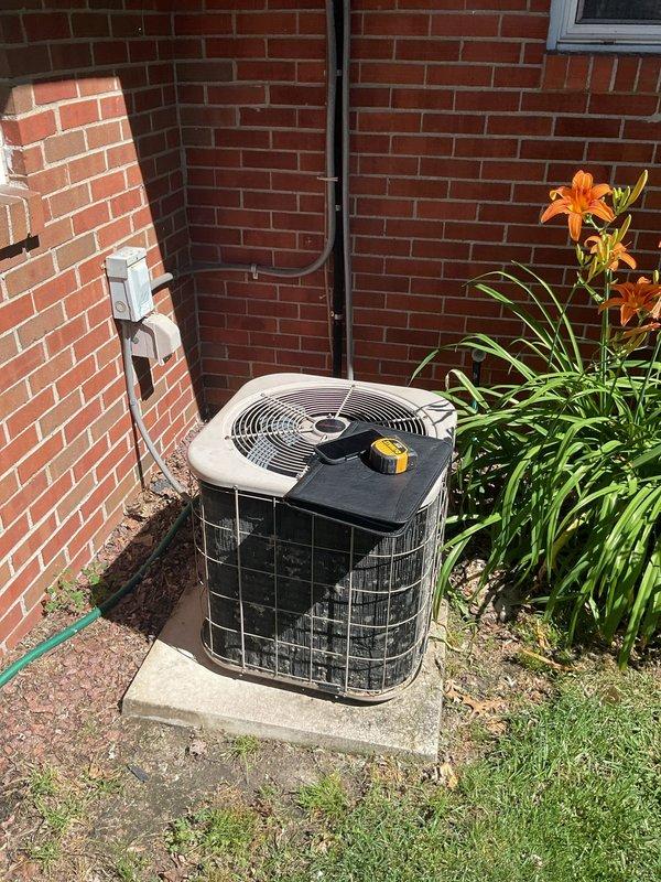 Performed comprehensive HVAC system evaluation for complete equipment replacement. Assessed existing outdoor condensing unit located in side yard area and documented electrical service panel configuration, including generator interlock device and circuit breaker arrangement. Provided detailed replacement estimate for new HVAC system installation.