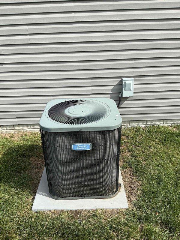 Responded to no cooling complaint on 8-9 year old residential air conditioning system. Upon arrival, performed comprehensive AC tune-up and diagnostic evaluation including electrical measurements and visual inspection of outdoor condensing unit. System found operating within normal parameters with proper amperage draw of 0.59A recorded on compressor circuit. Completed routine maintenance procedures, verified proper operation of all components, and confirmed unit cooling effectively with no issues present at time of service.