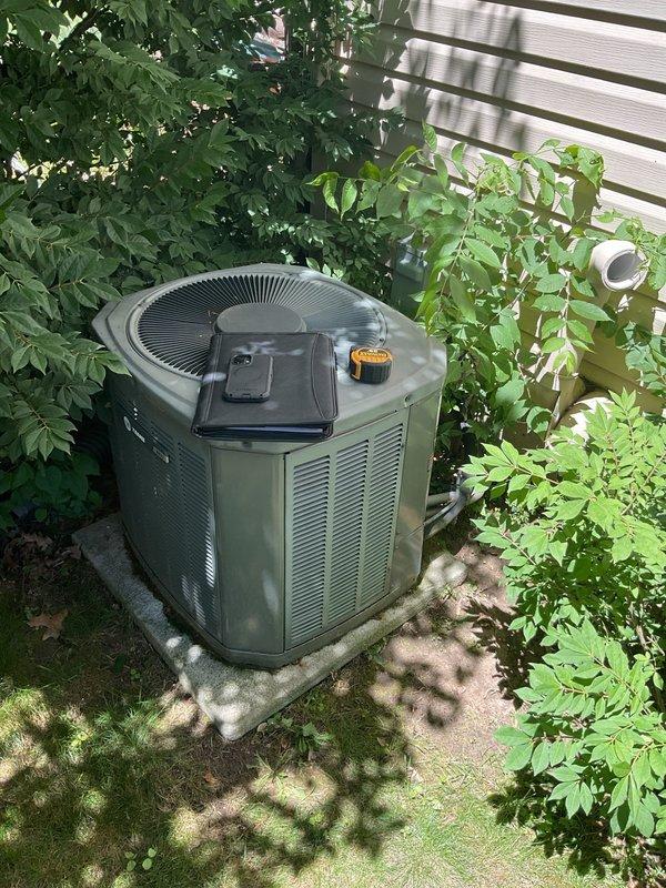 Conducted comprehensive site assessment for complete HVAC system replacement at residential property. Evaluated existing outdoor condenser unit with weathered concrete pad showing signs of age, moss growth, and vegetation encroachment. Inspected indoor furnace and air handler equipment located in basement mechanical room, including existing ductwork configuration, PVC ventilation piping, and current system layout. Documented equipment specifications, spatial constraints, and installation requirements through photographic documentation. Provided detailed replacement estimate covering removal of aging HVAC components and installation of new high-efficiency heating and cooling system.