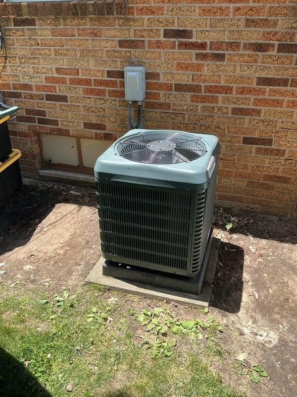 Responded to no cooling call on 7-year-old residential air conditioning system. Upon arrival, found outdoor condensing unit fan motor inoperative with evidence of electrical failure following homeowner's attempt to clean debris from unit. Diagnosed failed condenser fan motor with burnt windings, causing the reported burning smell. Replaced condenser fan motor and capacitor, verified proper electrical connections, tested system operation, and confirmed adequate airflow and cooling performance. System restored to normal operation with proper temperature differential across evaporator coil.