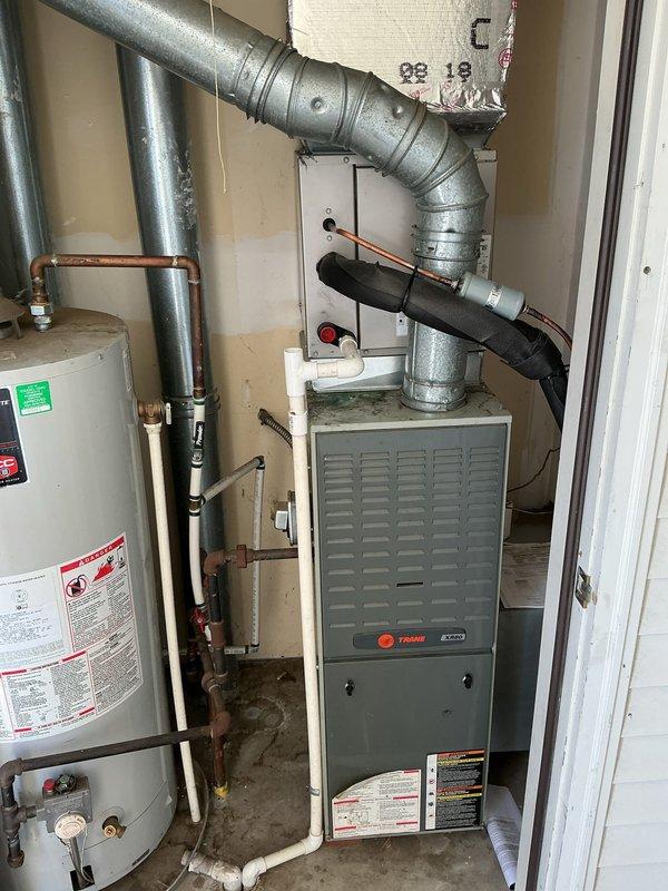 Installed new indoor evaporator coil for air conditioning system in residential mechanical room. Completed installation of CNPVP model coil unit manufactured by CAC/BDP, verifying proper refrigerant connections and system integration with existing Trane furnace and ductwork. All equipment tested and operational upon completion.