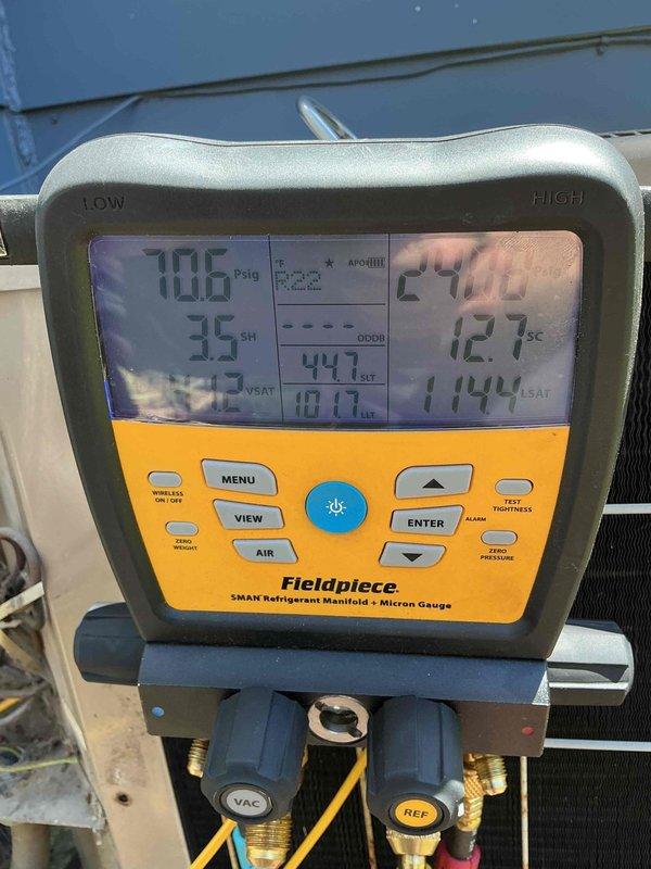 Responded to service call for 22-year-old air conditioning system failing to adequately cool residence, with indoor temperature reading 77°F and weak airflow. Upon inspection, performed comprehensive system diagnostics using digital manifold gauges to measure refrigerant pressures and temperatures. Testing revealed superheat of 35°F and subcooling of 127°F, indicating severe refrigerant undercharge and potential system restrictions. Evaluated attic equipment installation and insulation conditions around air handler. System exhibited continuous runtime without achieving setpoint due to insufficient cooling capacity. Documented equipment condition and diagnostic readings for customer review regarding repair versus replacement options given age of unit and extent of performance degradation.