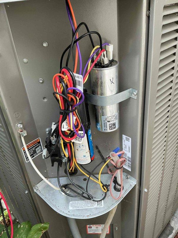 Completed comprehensive air conditioning tune-up on outdoor condensing unit, including inspection of electrical components, capacitor, and wiring connections. Addressed customer concern regarding rattling return vent noise occurring at system startup. Replaced air filter as requested and verified proper system operation upon completion.