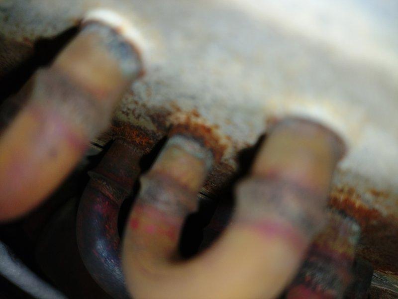 Responded to service call for air conditioning unit not cooling properly and experiencing freeze-up conditions. Upon inspection, discovered 15-year-old furnace system with evaporator coil showing signs of restricted airflow due to contamination. Found significant mold and debris accumulation on surrounding surfaces and ductwork, along with corroded refrigerant line connections exhibiting rust and mineral deposits. The evaporator coil's aluminum fins were compromised by poor air quality and lack of maintenance in the mechanical space. Documented existing conditions including deteriorated insulation, biological growth on wooden surfaces, and aged ductwork with discoloration indicating moisture exposure. Advised customer of findings and provided recommendations for system cleaning, possible coil replacement, and addressing underlying moisture issues to prevent future freeze-up conditions and restore proper cooling operation.