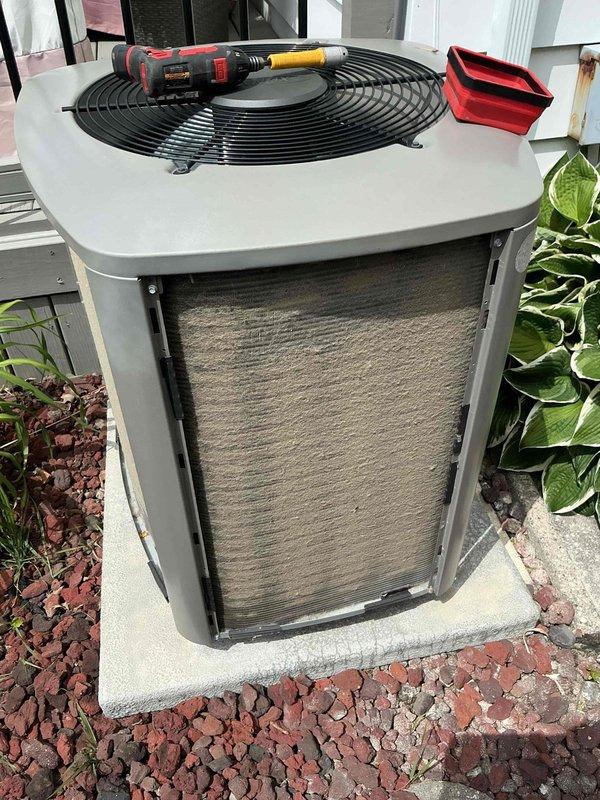 Responded to service call for 4-year-old air conditioning system not cooling optimally. Performed diagnostic inspection of outdoor condensing unit, accessed internal components through front panel, and evaluated system performance. Completed necessary maintenance procedures to restore proper cooling efficiency and system operation.