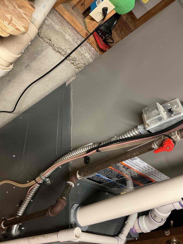 Responded to callback following new system installation where homeowner reported basement running colder than usual with cold air blowing from furnace area. Upon inspection, identified improperly connected or disconnected flexible duct at furnace unit causing conditioned air to discharge directly into basement space rather than through intended ductwork. Secured flexible duct connection to furnace plenum using proper clamps and verified all duct connections were sealed and properly routed. Confirmed airflow was redirected through duct system and no longer discharging into unconditioned basement space.