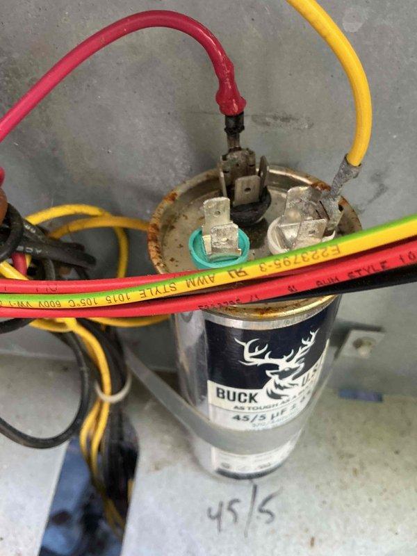 # HVAC Maintenance - Cooling

Completed routine cooling system maintenance on a 10-year-old air conditioning unit. Inspected and documented the condition of the electrical capacitor (45/5 MFD rating), noting significant rust and corrosion on mounting hardware and terminal connections. All electrical connections were verified secure, and system operational parameters were confirmed within acceptable ranges for continued service.