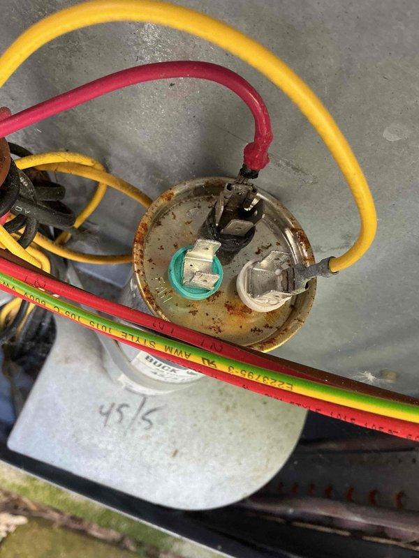 # HVAC Maintenance - Cooling

Completed routine cooling system maintenance on a 10-year-old air conditioning unit. Inspected and documented the condition of the electrical capacitor (45/5 MFD rating), noting significant rust and corrosion on mounting hardware and terminal connections. All electrical connections were verified secure, and system operational parameters were confirmed within acceptable ranges for continued service.