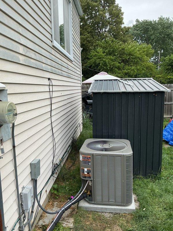 Completed installation of a 2.5 ton single-stage air conditioning system with C-width cased evaporator coil. Installed new outdoor condenser unit on concrete pad positioned 3 feet from electrical panel, ran 20 feet of new refrigerant lineset with proper insulation, installed new electrical disconnect and whip, and programmed new thermostat for optimal system operation.