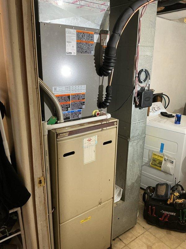 Completed installation of a 2.5 ton single-stage air conditioning system with C-width cased evaporator coil. Installed new outdoor condenser unit on concrete pad positioned 3 feet from electrical panel, ran 20 feet of new refrigerant lineset with proper insulation, installed new electrical disconnect and whip, and programmed new thermostat for optimal system operation.