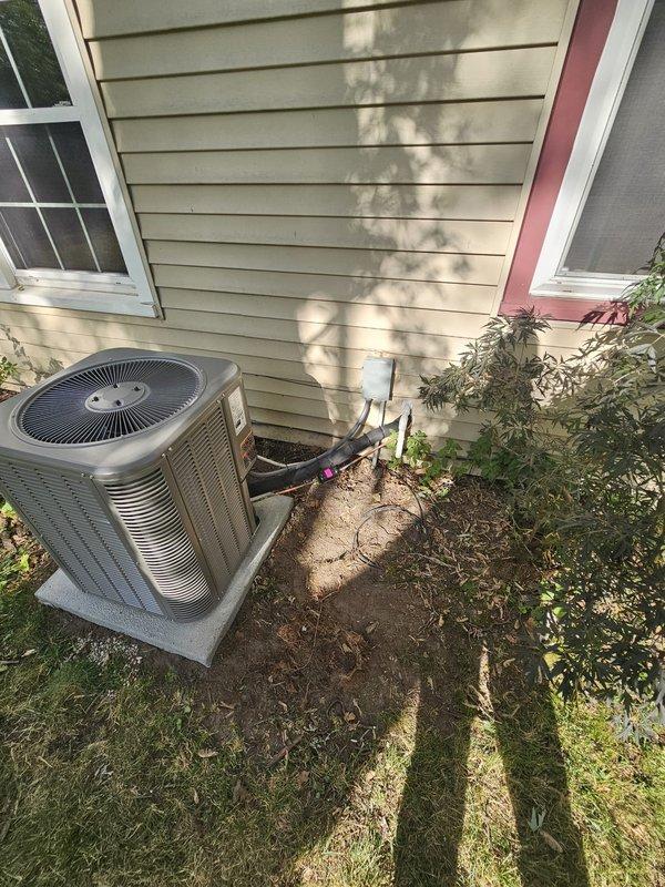 Completed full HVAC system installation including a Lennox 70,000 BTU 80% efficiency upflow furnace with cased evaporator coil installed in interior closet space. Fabricated and installed 1-inch filter rack lift box to accommodate proper filtration access. Installed new refrigerant lineset with insulation connecting indoor and outdoor units, secured along exterior siding and routed through closet space. Set 13 SEER outdoor condensing unit on new concrete equipment pad adjacent to home exterior with proper clearances. Installed electrical disconnect and whip for outdoor unit per code requirements. Relocated and installed new programmable thermostat near return air location for improved system control and accessibility. All ductwork connections, exhaust venting, and refrigerant lines completed with proper sealing and insulation. System tested, charged to manufacturer specifications, and verified operational.