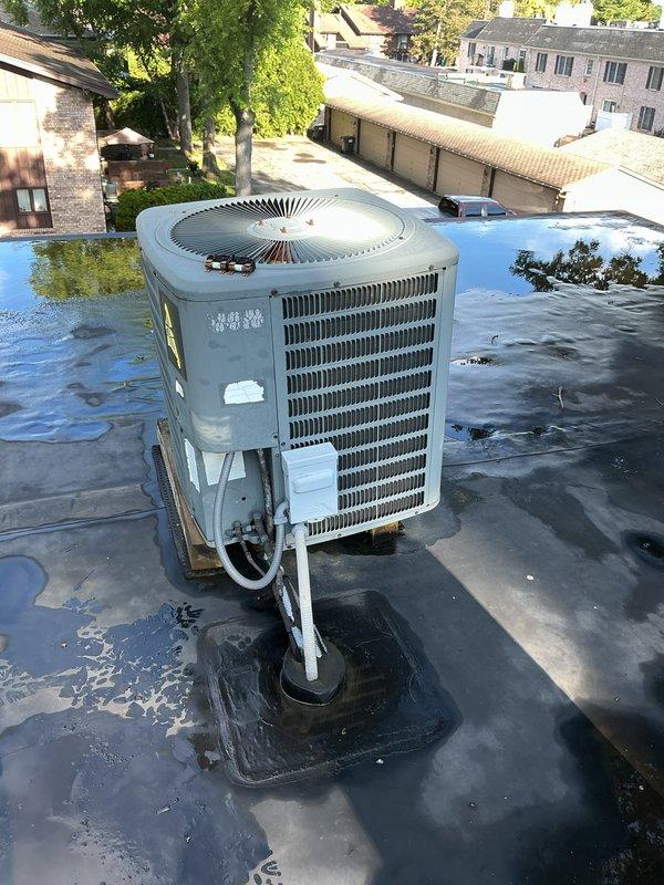 Completed scheduled tune-up and preventive maintenance on a 10-year-old rooftop air conditioning unit at a condominium property. Accessed equipment through attic to perform comprehensive inspection of both the rooftop condenser unit and indoor air handler components, including blower assembly, electrical connections, capacitor, and wiring harness. All systems inspected and found operating within normal parameters.