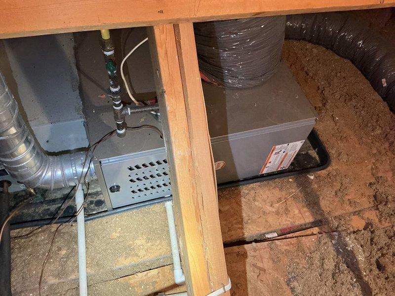 Completed comprehensive AC tune-up and system evaluation for approximately 20-year-old outdoor cooling unit for new homeowner. Performed standard maintenance procedures including inspection of all accessible components, verified system operation, and documented equipment condition with photos of attic space and crawl space HVAC installation areas.