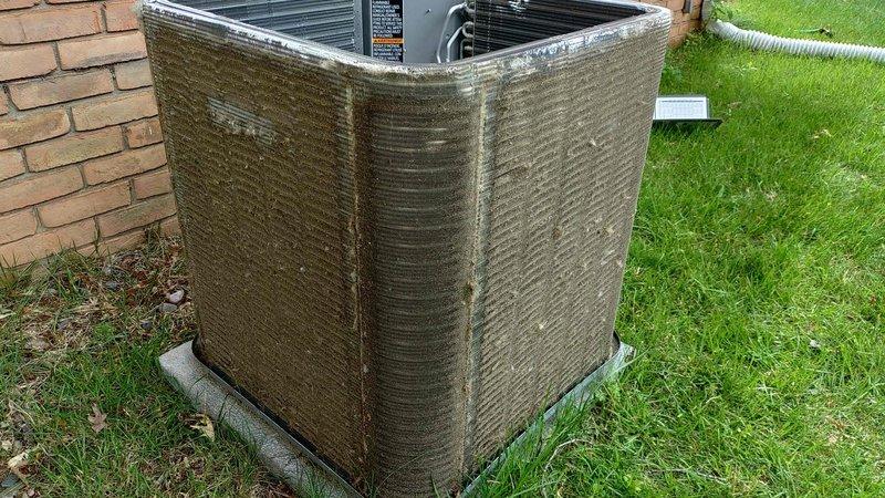 Completed standard air conditioning tune-up on a one-year-old residential condensing unit. Performed routine maintenance inspection, verified system operation, and documented unit condition showing exterior weathering and dirt accumulation typical of outdoor exposure.