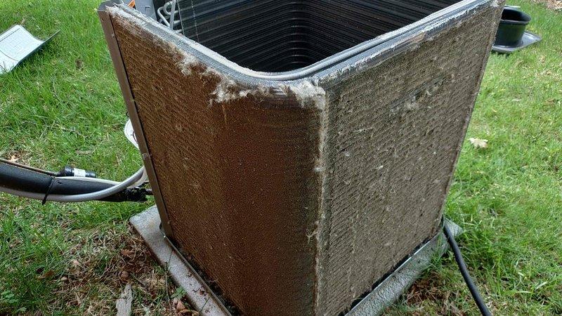 Completed standard air conditioning tune-up on a one-year-old residential condensing unit. Performed routine maintenance inspection, verified system operation, and documented unit condition showing exterior weathering and dirt accumulation typical of outdoor exposure.
