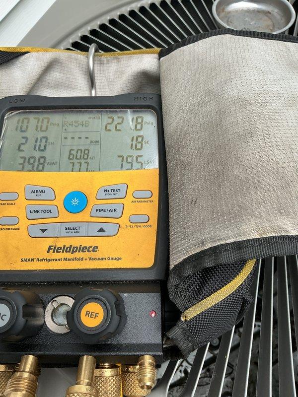 Completed annual preventative maintenance on a one-year-old heat pump system located on the side of the property. Performed comprehensive system diagnostics using refrigerant manifold gauges, verified operating pressures and temperatures were within manufacturer specifications, inspected electrical components including fuses and contactors, confirmed proper refrigerant line insulation and securing, and documented all findings with photographic evidence.