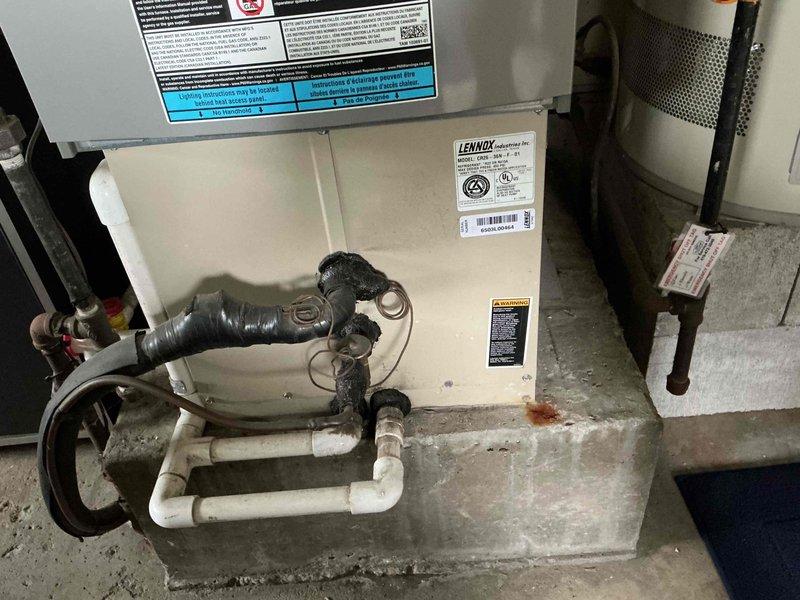 Completed comprehensive tune-up and preventive maintenance on 5-year-old residential split system air conditioning unit. Performed standard inspection of outdoor condenser unit and indoor Lennox air handler, verified proper operation of all components, and documented system condition with photographs for service records.