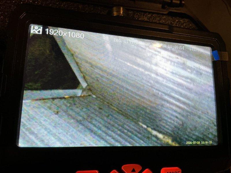 Completed annual maintenance on 27+ year old air conditioning system. Performed standard tune-up procedures including inspection of water heater components showing significant mineral buildup on brass fittings and pressure relief valve, and conducted ductwork inspection using diagnostic camera to assess interior conditions of ventilation system.