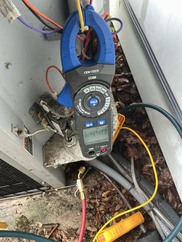 Completed annual maintenance on a 14-year-old air conditioning system. Performed visual inspection of outdoor condenser unit, verifying coil cleanliness and protective grille integrity. Measured electrical amperage at the unit using clamp meter to confirm proper system operation and component performance within manufacturer specifications.