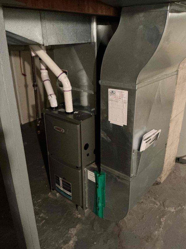 Completed comprehensive air conditioning tune-up on 21-year-old residential HVAC system. Performed standard maintenance protocol including inspection of furnace unit, ductwork connections, condensate drain lines, and all visible system components to ensure proper operation and efficiency.