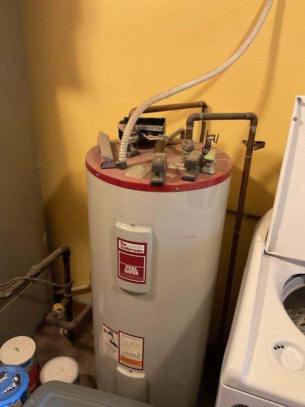 Completed comprehensive HVAC system evaluation for air conditioning replacement estimate, including assessment of existing equipment location, electrical service capacity, and utility connections. Documented current installation conditions with detailed photographic records of utility area configuration and exterior electrical panel to support accurate equipment sizing and installation planning for proposed AC system upgrade under online promotional program.