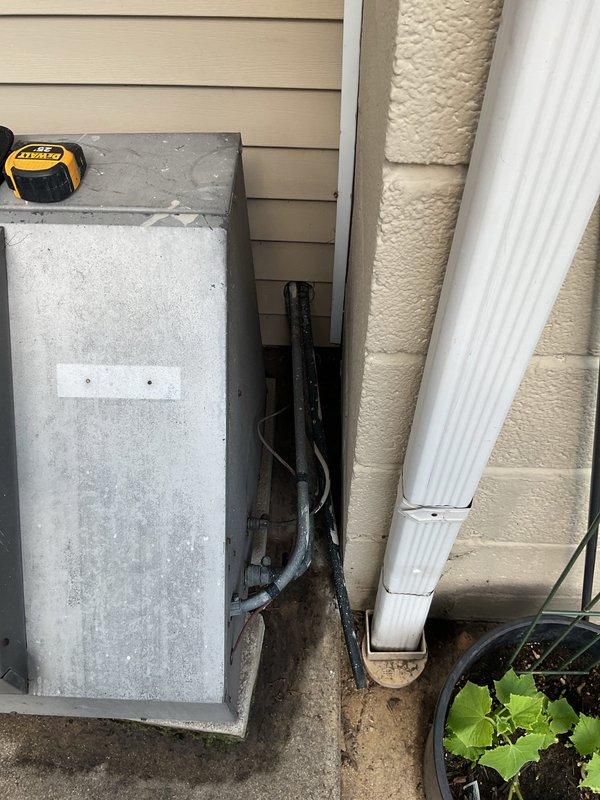 Completed comprehensive HVAC system evaluation for air conditioning replacement estimate, including assessment of existing equipment location, electrical service capacity, and utility connections. Documented current installation conditions with detailed photographic records of utility area configuration and exterior electrical panel to support accurate equipment sizing and installation planning for proposed AC system upgrade under online promotional program.