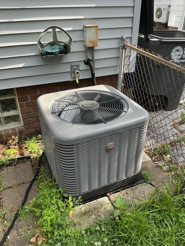 Completed comprehensive tune-up and maintenance on 10-year-old residential air conditioning system that had not been operated since last season. Performed full system inspection of outdoor condenser unit and indoor air handler, checked refrigerant levels, cleaned condenser coils, verified electrical connections, tested thermostat operation, and inspected condensate drain system. System tested successfully and confirmed operational with all components functioning within normal parameters.