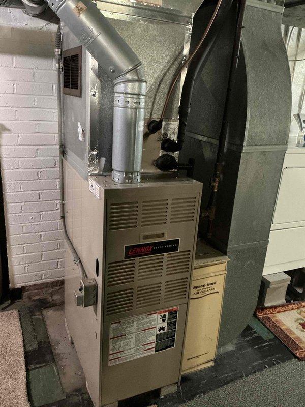 Responded to service call for 27-year-old Lennox HVAC system experiencing repeated breaker trips affecting both air conditioning and furnace operation. Inspected electrical connections, circuit breaker panel, and system components in basement mechanical room to diagnose intermittent tripping issue. Identified electrical fault causing overcurrent condition and performed necessary repairs to restore safe operation of both heating and cooling systems.