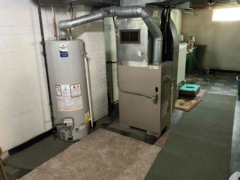 Responded to service call for 27-year-old Lennox HVAC system experiencing repeated breaker trips affecting both air conditioning and furnace operation. Inspected electrical connections, circuit breaker panel, and system components in basement mechanical room to diagnose intermittent tripping issue. Identified electrical fault causing overcurrent condition and performed necessary repairs to restore safe operation of both heating and cooling systems.
